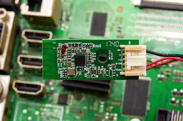 Printed circuit boards with electronic components close-up, photo for a project about the...