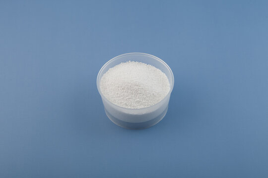 Benzoic acid or Carboxybenzene powder in plastic bowl. Other names: Dracylic acid, Benzoyl alcohol. Food additive E210, food preservative. Solid organic compound, chemical formula C7H6O2