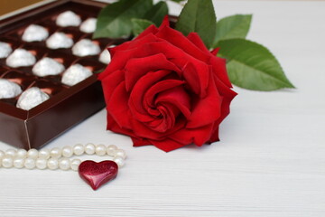 A beautiful rose, a small gift, a heart and a box of chocolates will make us happy any day