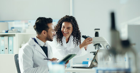 Science, team and people on tablet in lab with microscope for analysis, medical research and study. Chemistry, pharmaceutical and man with woman on digital tech for meeting, results and online report