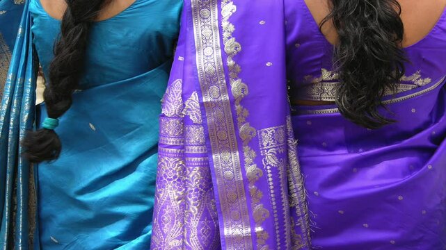Silk saris' in India . A sari is a dress  and a women's garment in the Indian subcontinent.