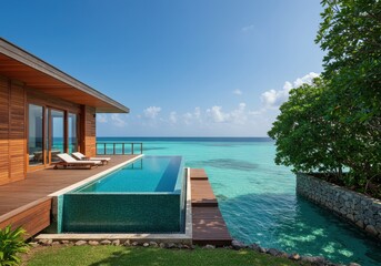 Fototapeta premium Infinity pool villa overlooking turquoise ocean in tropical destination
