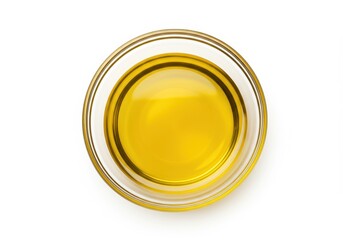 Olive oil in a glass bowl, top view, isolated on white background, cooking ingredient