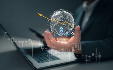 Businessman holding holographic globe and financial growth chart by laptop for stock market analysis concept using to global economy, investment, and business success or Business planing money growth.