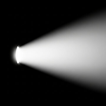 side view of torch light beam glowing through darkness