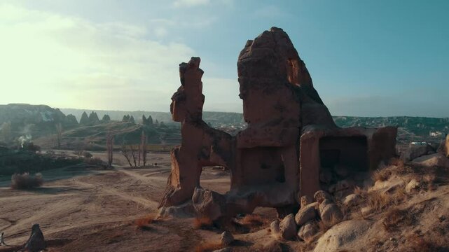 Surreal rock formations resembling mythological creatures and dragons in Cappadocia's Imagination Valley, Turkey. A fantastical landscape of fairy chimneys.