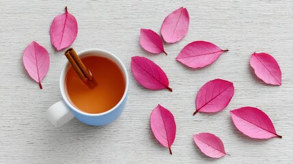 Autumnal Tea in a Blue Mug with Pink Leaves