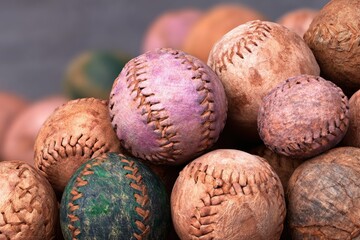 Close-Up of Dusty Old Worn Baseballs in a Pile