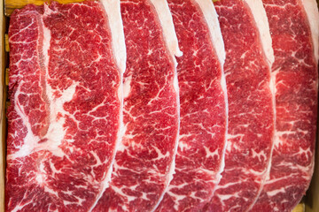 Cropped shot of raw beef Shabu shabu delights in raw meat appetizing beauty. Savoring juicy...