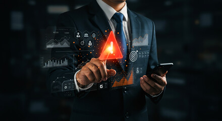 Businessman interacting with digital interface and touching a red warning sign alert icon