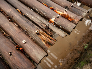 Weathered and broken bamboo bridge with due to long exposure of sun beam and rain 