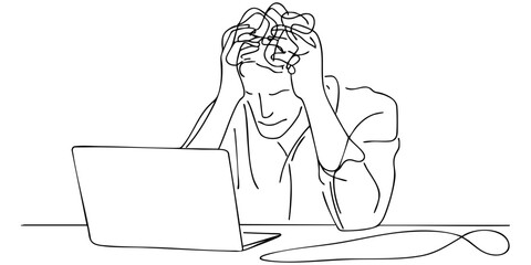 Individual experiencing stress while working on a laptop in a simple indoor setting