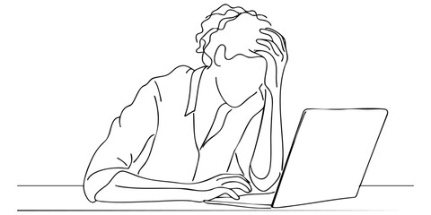 Frustration while working at a laptop in a home office environment during daytime