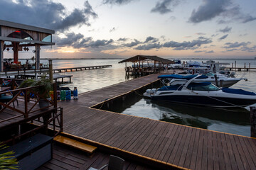 Boat dock against beautiful dramatic sunset sky