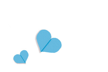 Light blue heart shaped paper on transparent background. Composition of collage with rough texture of paper. Scalloped edges. Love and romance. Lovely halftone color.