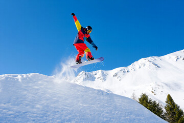A snowboarder in red gear carving through snow on a sunny mountain slope.