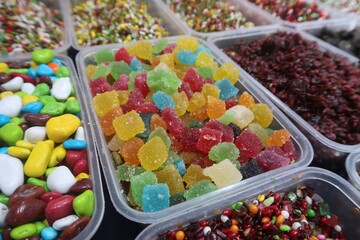 colorful sugar coated mixed fruits jelly candy combo and chocolate gems