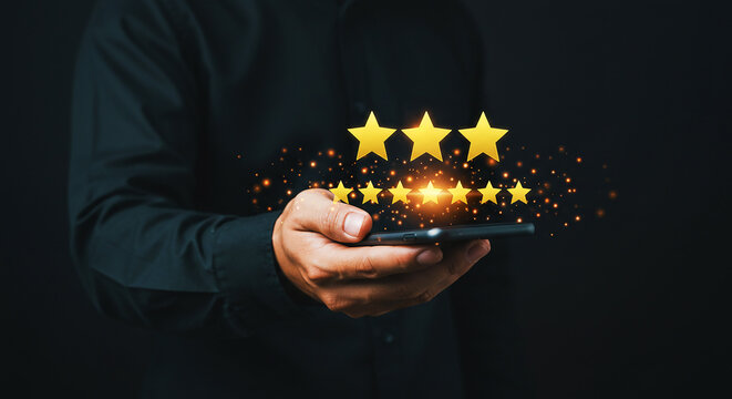 A businessman in a suit pointing at a glowing rocket illustration on a black background in a studio