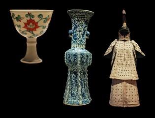 A curated collection showcasing exquisite examples of ancient Asian artistry.  A delicate porcelain cup, an intricately designed blue and white vase, and a historical suit of armor are displayed again