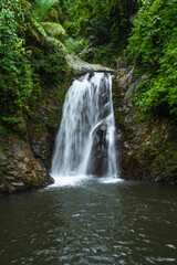 Naklejka premium Green Scenic Tropical Waterfall In Vietnam