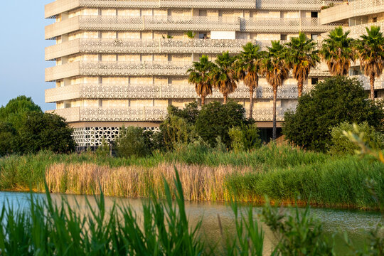 Modern residential complex with palm trees and vertical greenery, Montpellier, France, innovative architecture promoting ecological values and energy-efficient living