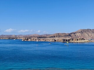 blue sea and blue sky as a natural background . view from the cliff to the sea with boats and sky...