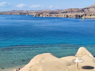 blue sea and blue sky as a natural background . view from the cliff to the sea with boats and sky...