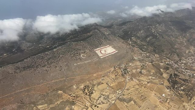 The giant TRNC flag in the Beşparmak Mountains of Northern Cyprus, shot from an airplane