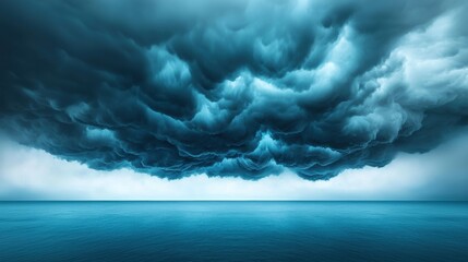 Black storm clouds gathering over a vast ocean, creating a powerful and dramatic scene.