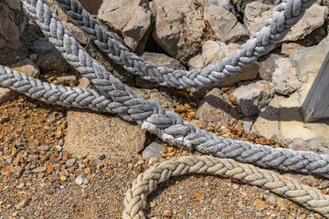 Old fishing nets and ropes on the shore of the port