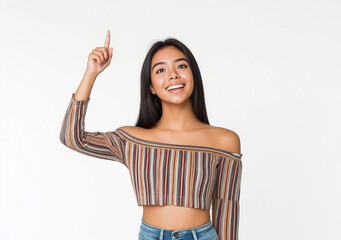 Young Woman Smiling and Pointing Up – High-Resolution Studio Portrait on White Background, Wearing Off-the-Shoulder Striped Top and Jeans, Expressive Pose for Marketing or Advertising Use