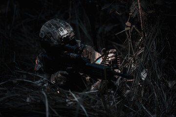Army sniper during the military operation, dark process