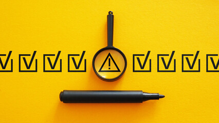 Triangle caution warning sign among of correct sign marks as notification about error or maintenance