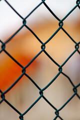 Fototapeta premium Lattice texture on a blurred orange background