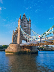 Obraz premium Close view to the Tower Bridge and the Thames River at sunset in Summer, the main landmark of London, England, United Kingdom 