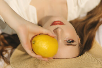 young woman with lemon