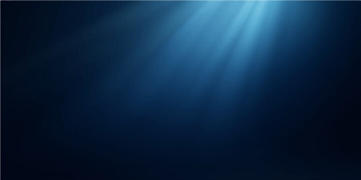 Abstract blue light rays create a dark underwater motion texture background with a deep ocean blur and shine pattern