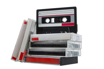 Retro audio cassette and stack of cases with red labels isolated on white back