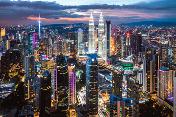 Aerial view of financial district skyline at night, Kuala Lumpur, Malaysia