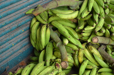 Pile of ripe banana kept for sale on outdoors. Bananas in a group