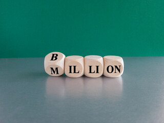 Turned a cube and changes the word Million to Billion. Beautiful green background, grey table....