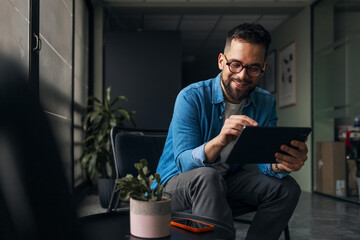 Man Using Digital Tablet in Modern Office Environment