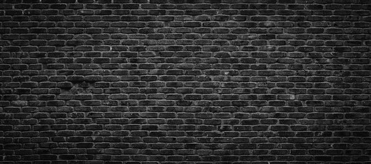 black brick wall for gloomy background design, dark stonework texture