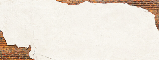 brick wall covered with crumbling plaster, peeling white stucco