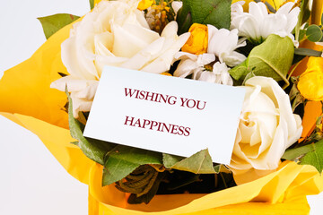 The conceptual phrase WISHING YOU HAPPINESS. The concept of good mood and pastime
