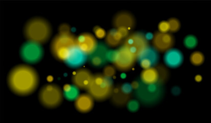 Multicolored blurred bokeh particles with violet, blue, pink hues floating on black background, creating festive or dreamy abstract composition.