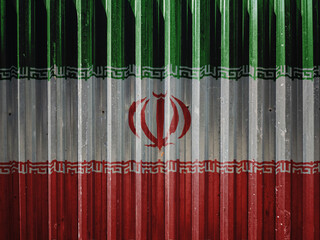 Iran flag painted on metal fence, symbolizing political isolation, conflict or international tension involving Iran.