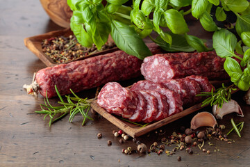Sliced smoked sausage with herbs and spices.