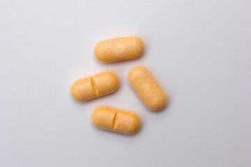 Vitamin C tablets isolated on white background. Vitamin C is a powerful antioxidant that can strengthen your body’s natural defenses.