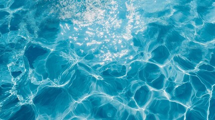 Obraz premium A serene view of sparkling blue water with gentle ripples, evoking tranquility and natural beauty.